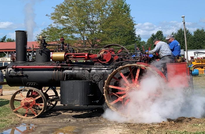 Image of a running antique steam tractor
