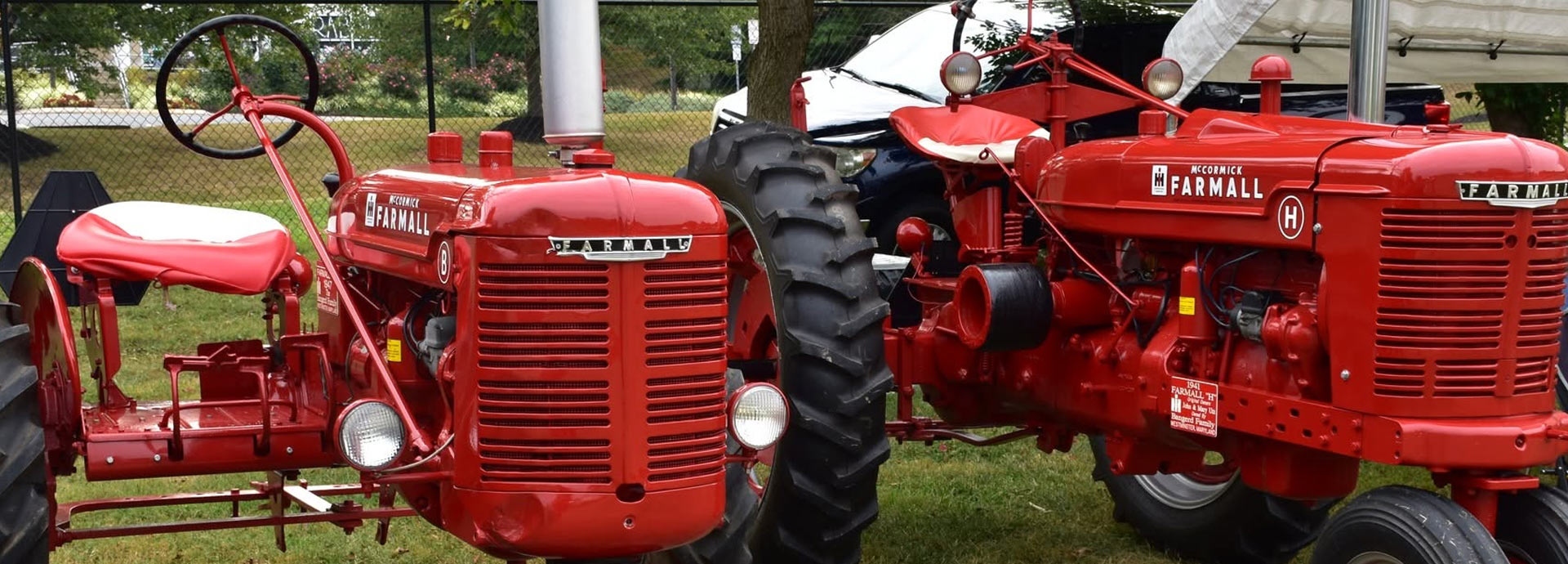 Image of several antique farm tractors