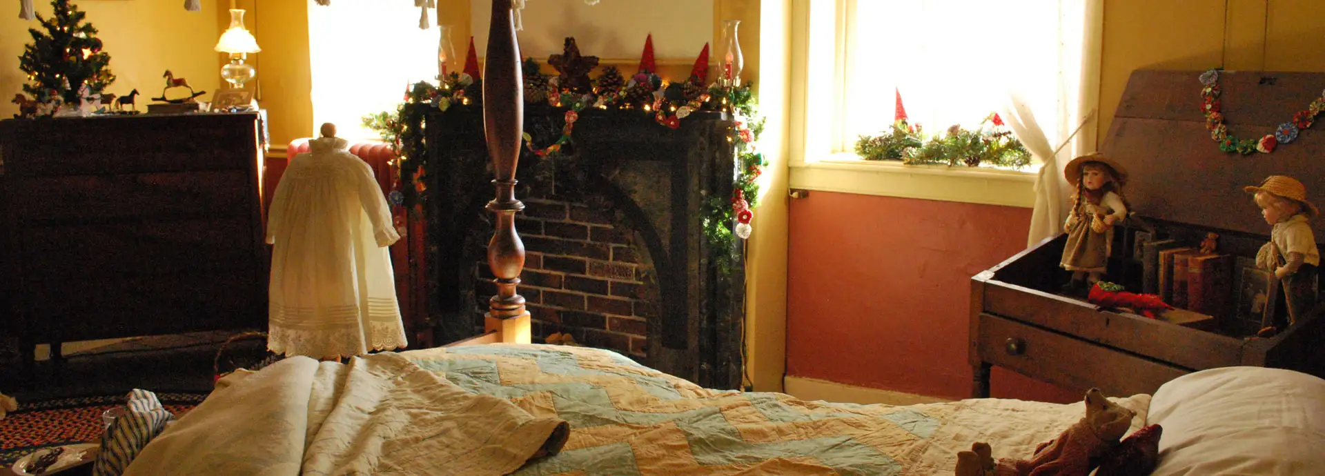 Image of a 19th century period room with homemade clothes and Christmas decorations
